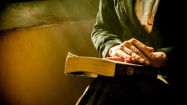 Christian reading the Bible