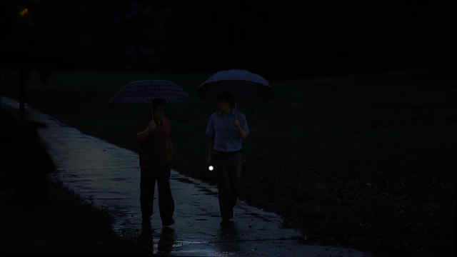 On a dark night, light rain pattering