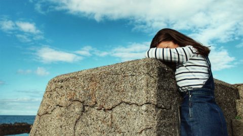 Girl kneeling on the stone