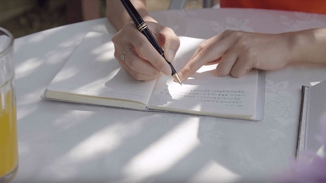 a Christian writing the Word of God
